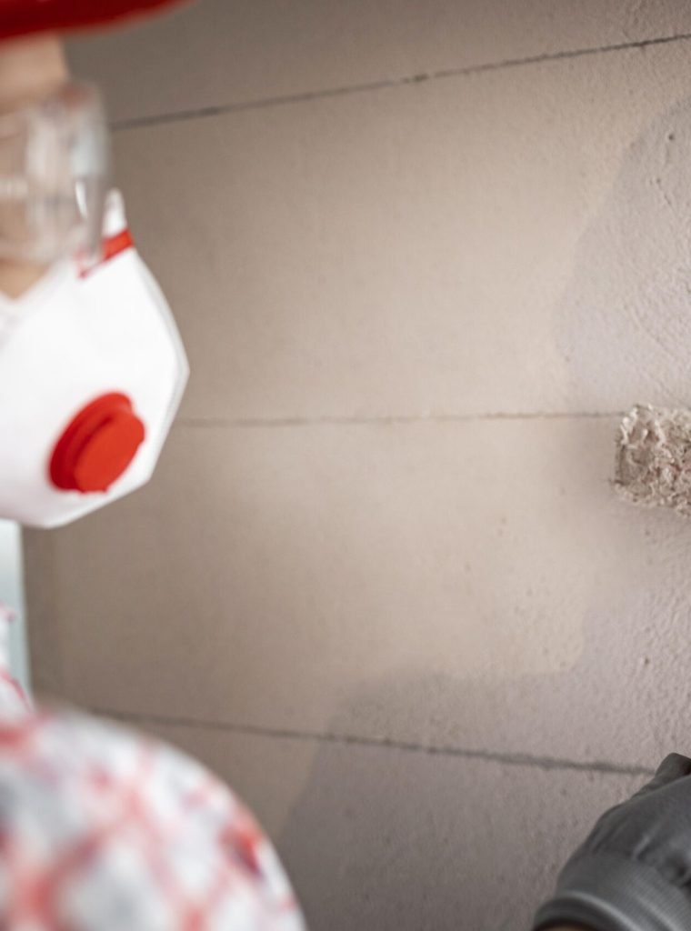 back-view-female-construction-worker-with-helmet-paint-roller